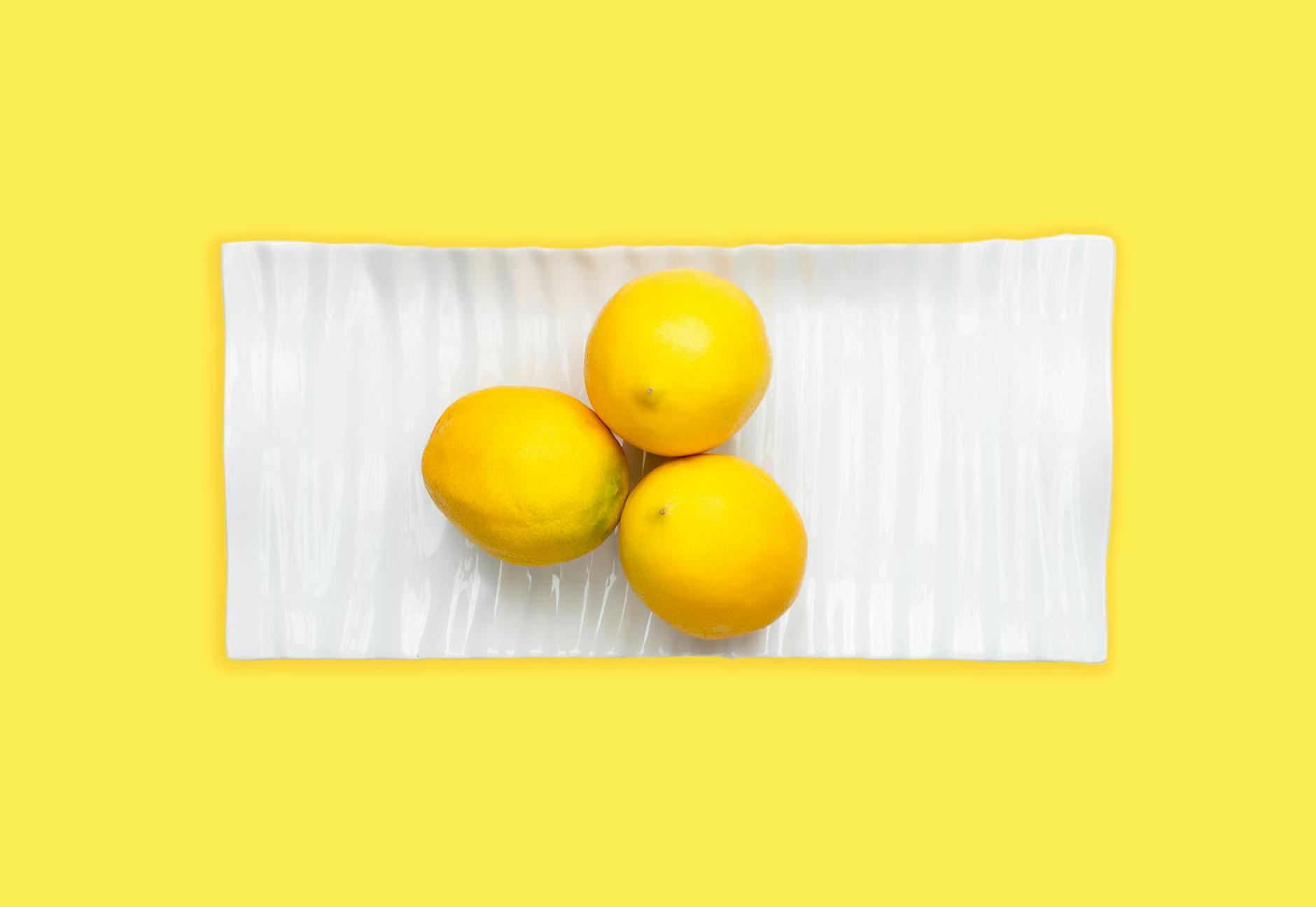 Fresh lemons on a white background, symbolizing renewal and healing