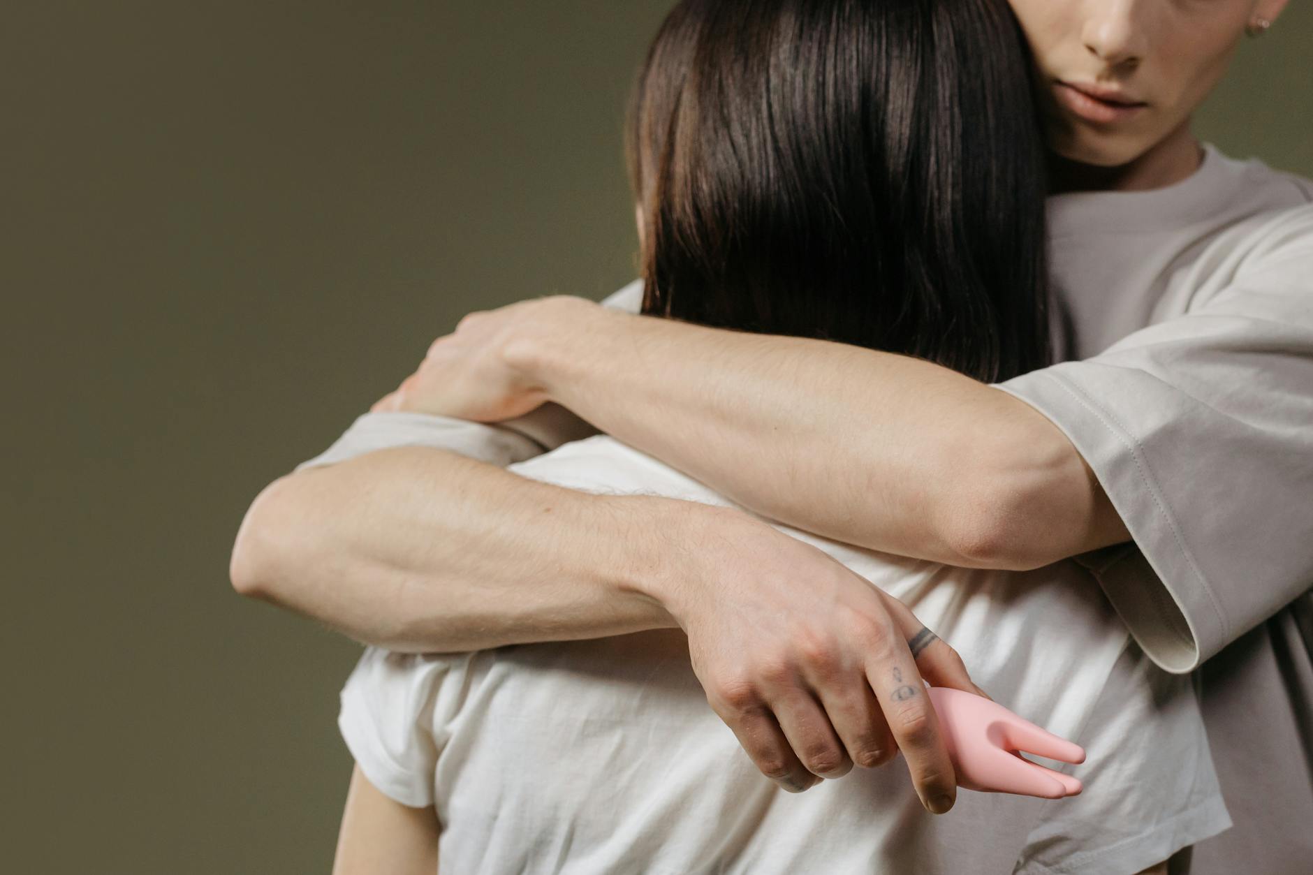 A couple embracing intimately, showing emotional and physical connection.